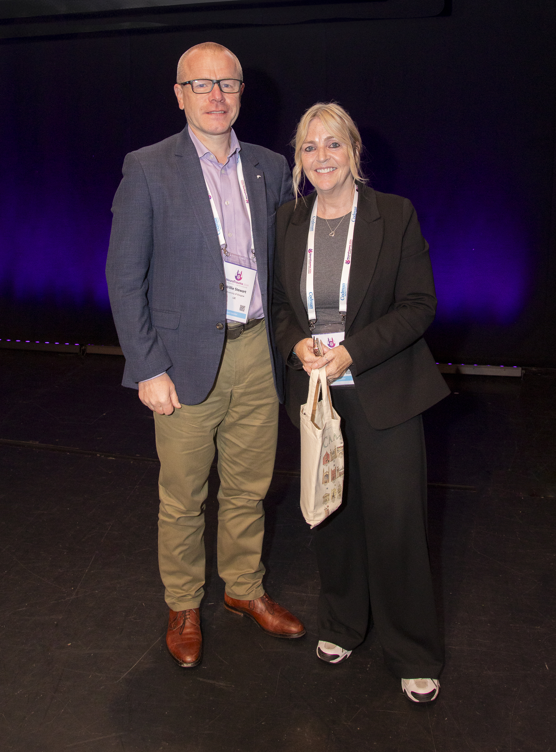 INTS2024-8278 Dr. Willie Stewart and Dawn Astle standing on stage