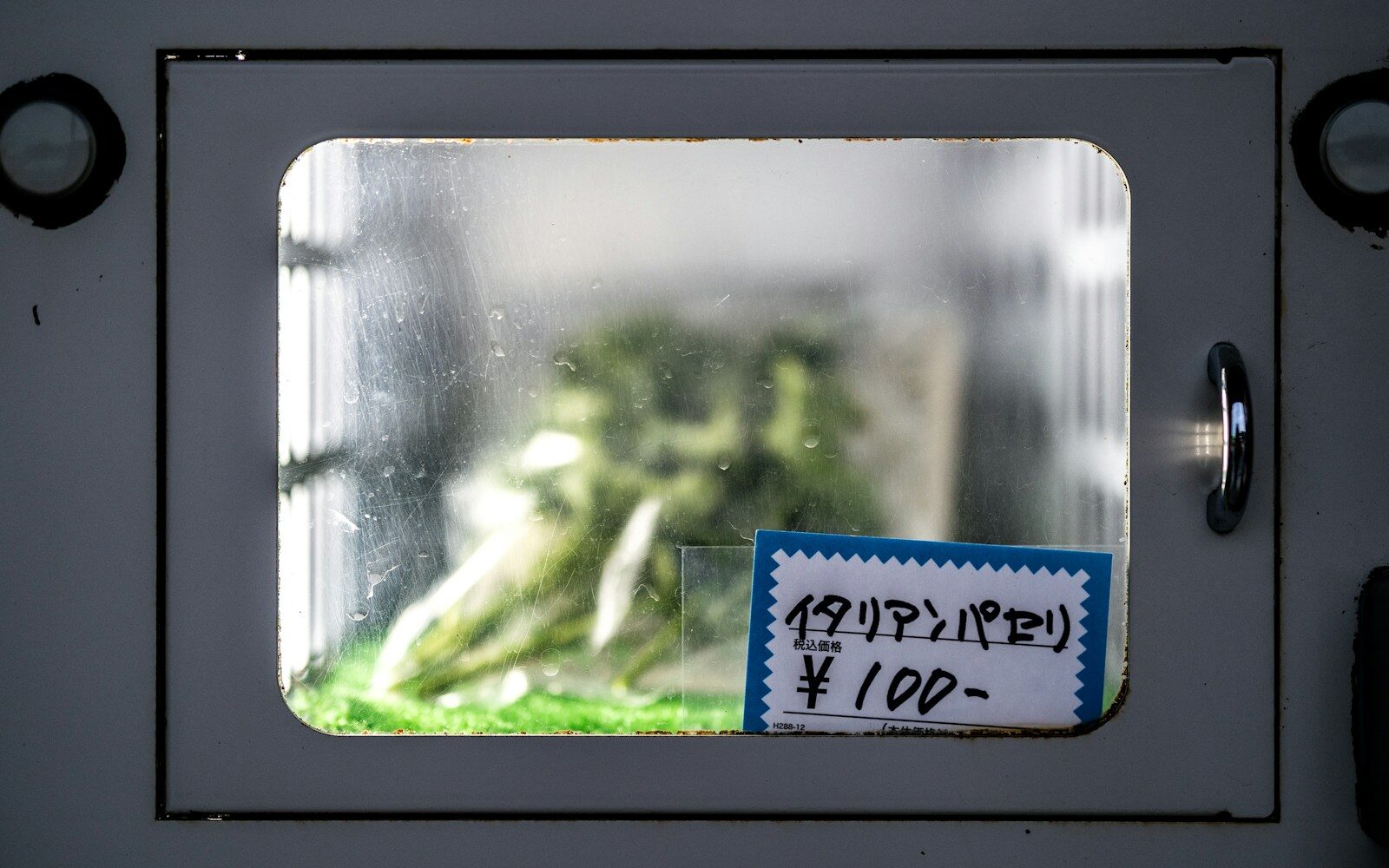 A close up of a microwave with a sign on it